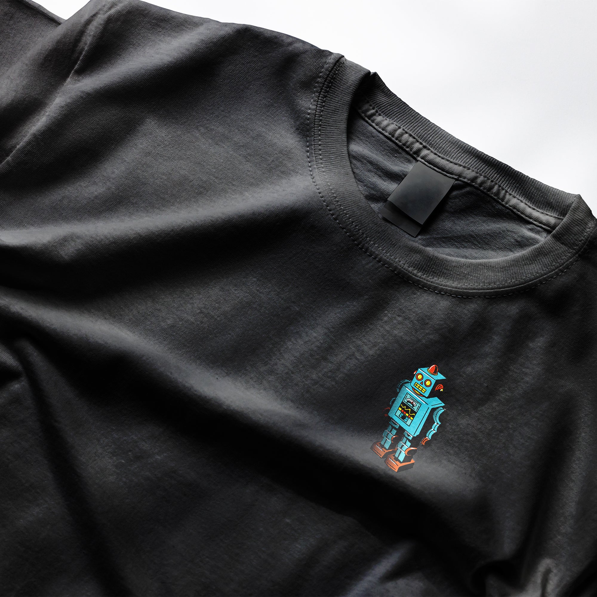Black t-shirt with a blue robot design on a white background from Clothing Dioxide, UK