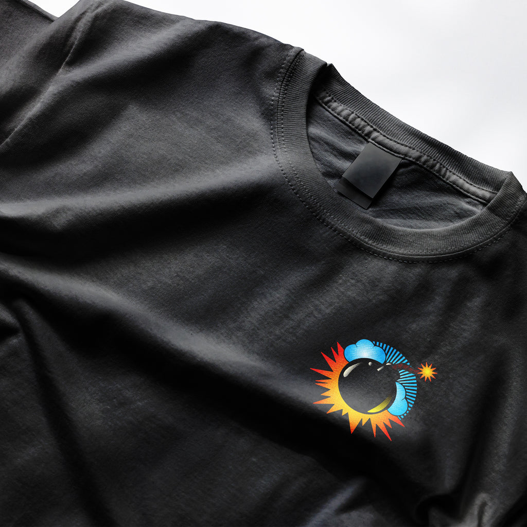 Bomb Tee from Clothing Dioxide. Black t-shirt with a colorful logo on a white background