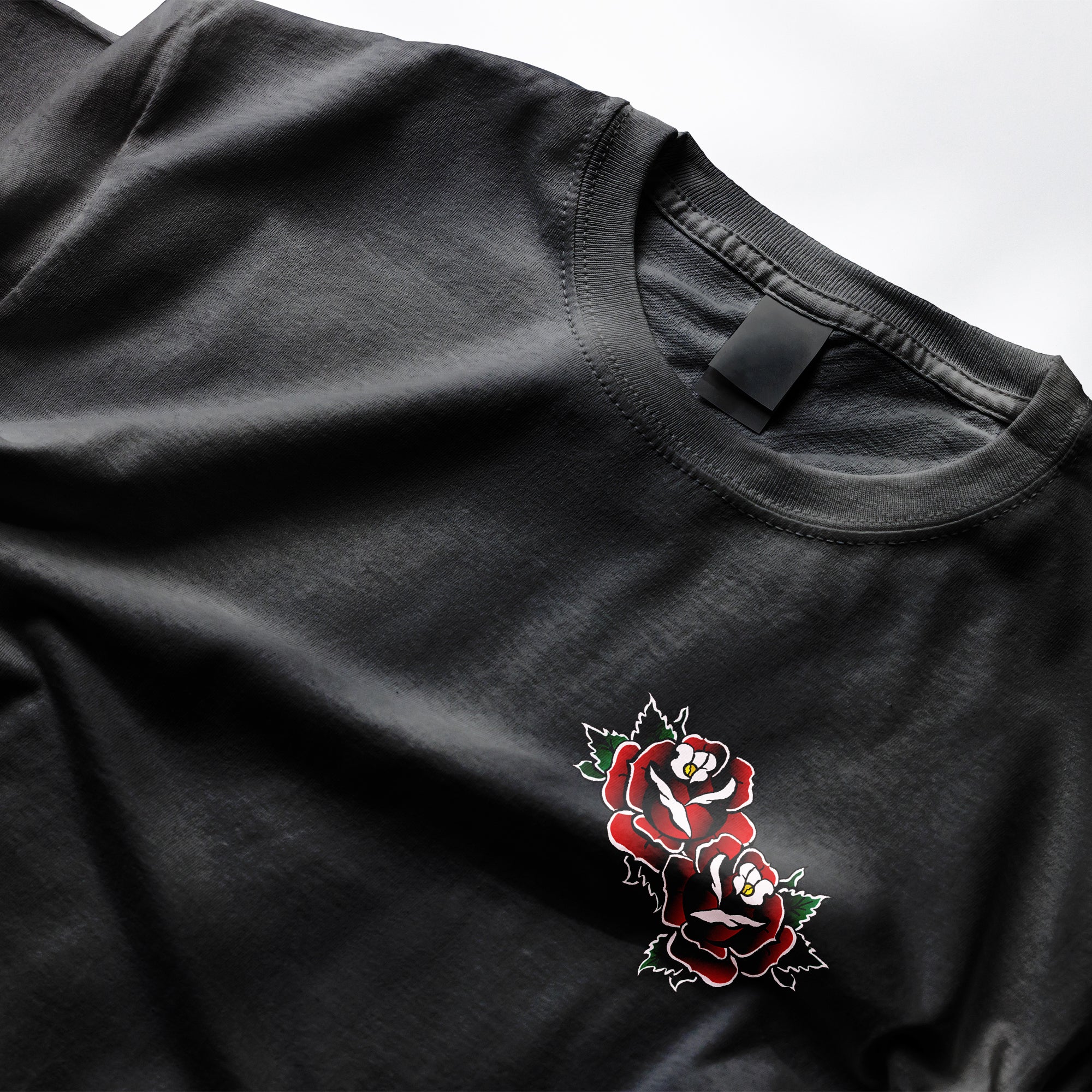 Front graphic - The Dagger Tee design is based on a traditional tattoo-style dagger and rose, Clothing Dioxide, UK