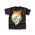 Large dark alternative back graphic print featuring a detailed cracked human skull engulfed in roaring orange and yellow flames on a heavy black cotton tee