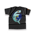 Large alternative back graphic print featuring a detailed cartoon shark with sharp teeth and a fierce orange eye ripping through a dark circular portal