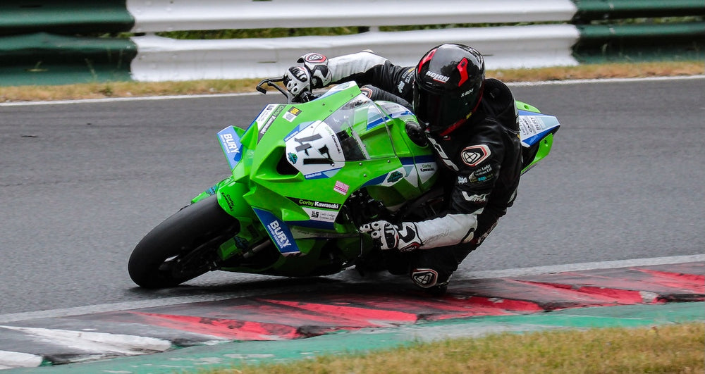 RatMally brand ambassador Liam Murtagh racing his number 17 aerodynamic wing-equipped Kawasaki ZX10RR motorcycle through the famous mountain section at Cadwell Park.