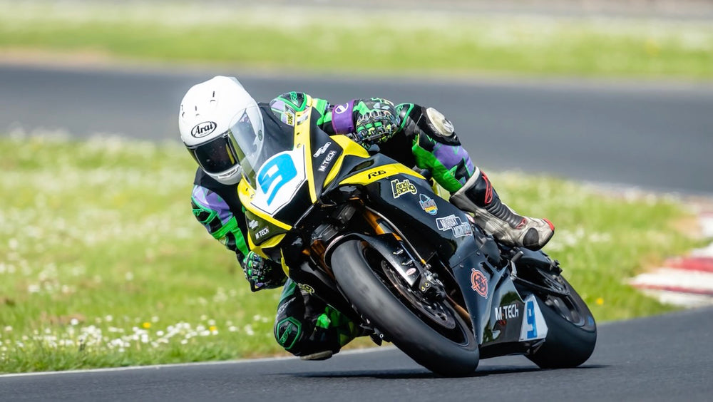 RatMally brand ambassador Nick Round racing his number 9 Yamaha R6 motorcycle to victory at Croft Circuit during the No Limits Endurance championship.
